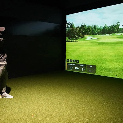 Man using golf simulator