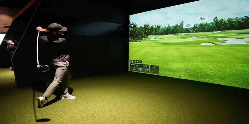 Man using golf simulator