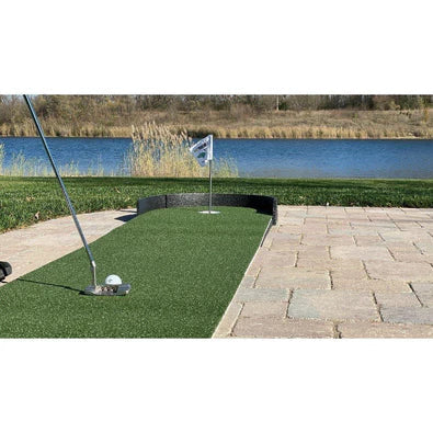 Putting mat outdoors on patio by water