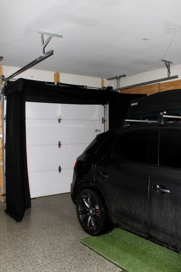 Vanish Lite around garage door with parked car.