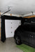 Vanish Lite around garage door with parked car.